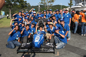 Smiling team members, all events completed