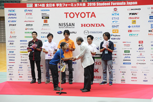 Team leader receiving METIC Award and Spirit of Excellence Awards for ICV Class